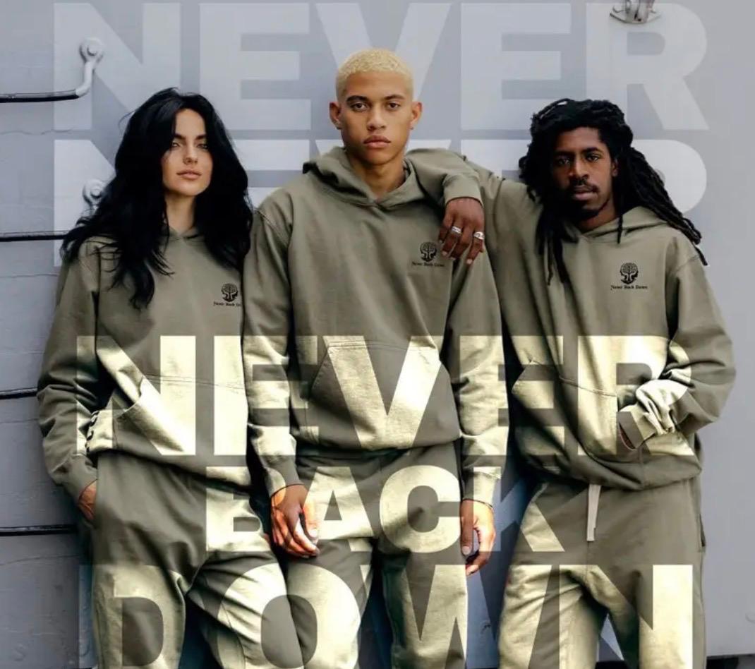 Three people wearing Never Back Down hoodies